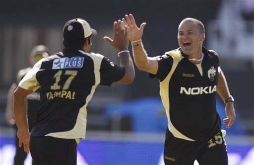 Kolkata Knight Riders' Charl Langeveldt and Yashpal Singh celebrate the dismissal of Rajasthan Royals' Naman Ojha during their IPL match in Durban on Wednesday. (AP Photo) Match 53: JAI vs KKR