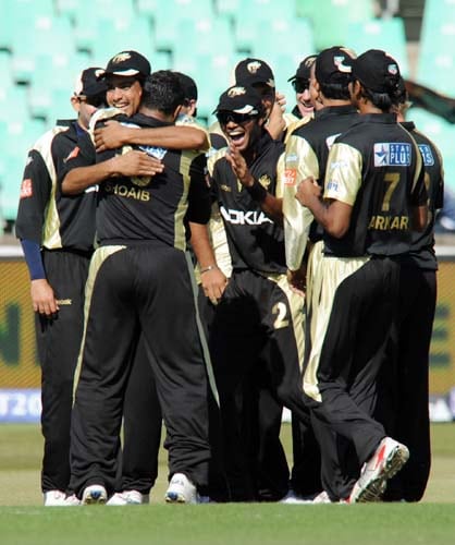 Players of Kolkata Knight Riders celebrate the dismissal of Rajasthan Royals' Naman Ojha during their IPL match in Durban on Wednesday. (AFP Photo) Match 53: JAI vs KKR