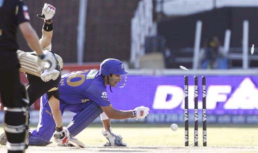 Rajasthan Royals' Naman Ojha removes the bails for the dismissal of Kolkata Knight Riders' Brad Hodge during their IPL match in Durban on Wednesday. (AP Photo) Match 53: JAI vs KKR