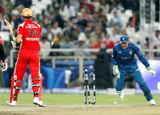 Bangalore Royal Challengers player Kevin Pietersen, left, is stumped out by Adam Gilchrist, right, from the Deccan Chargers at the Indian Premier League Twenty20 cricket match in Cape Town on Wednesday, April 22, 2009. (AP Photo) Match 8: HYD vs BLR