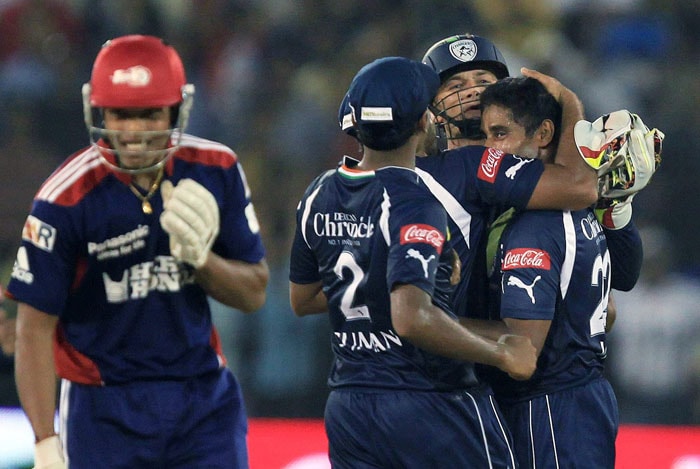 Deccan Chargers captain Adam Gilchrist hugs his bowler Chaminda Vaas after pick up last Delhi Daredevils wicket during IPL 3 match at Barabati Stadium in Cuttack. (PTI Photo) IPL 3: Chargers vs Delhi