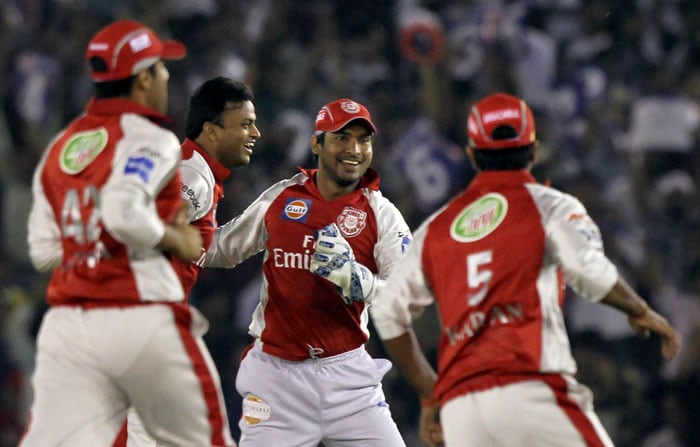Kings XI Punjab's bowler Shalabh Srivastava along with captain Kumar Sangakkara and teammates celebrates the wicket of Kolkata Knight Riders' batsman Chris Gayle during their IPL 3 match in Mohali. (PTI Photo) IPL 3: Kolkata vs Punjab