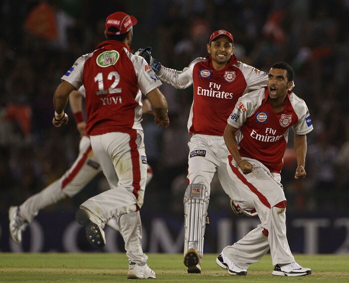 Kings XI Punjab's Bipul Sharma, Yuvraj Singh and wicketkeeper Manvinder Bisla celebrate the wicket of Royal Challengers Bangalore's Virat Kohli during their Indian Premier League 3 match in Mohali. (Getty Photo) IPL 3: Punjab vs Bangalore
