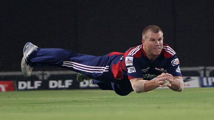 Delhi Daredevils' David Warner takes a catch of Royal Challengers Bangalore batsman Robin Uthappa during the IPL match at Feroz Shah Kotla Stadium in New Delhi. (PTI Photo) IPL 3: Delhi vs Bangalore