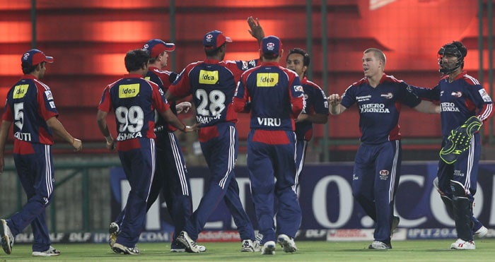 Delhi Daredevils' players celebrate dismissal of Royal Challengers Bangalore batsman Cameron White during the IPL match at Feroz Shah Kotla Stadium in New Delhi. (PTI Photo) IPL 3: Delhi vs Bangalore