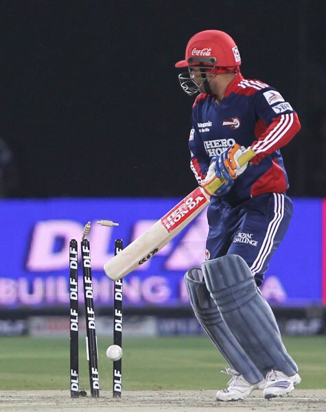 Delhi Daredevils' Virender Sehwag is bowled out by Royal Challengers Bangalore's Abhimanyu Mithun during their IPL match at the Feroz Shah Kotla Stadium in New Delhi. (PTI Photo) IPL 3: Delhi vs Bangalore