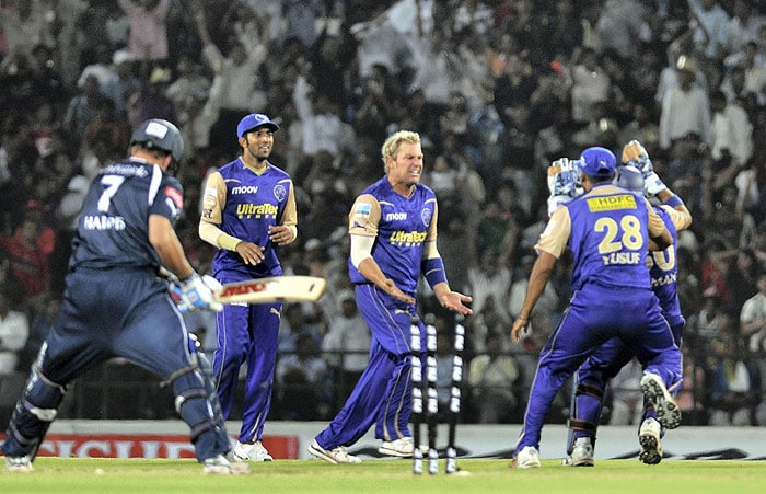 Rajasthan Royals captain Shane Warne celebrates with teammates after the run out of Deccan Chargers batsman Harmeet Singh during the IPL match at VCA stadium in Nagpur. (PTI Photo) IPL 3: Royals vs Chargers