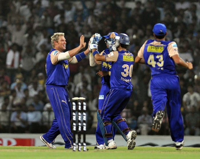 Rajasthan Royals captain Shane Warne celebrates with teammates after the dismissal of Deccan Chargers batsman Dwayne Smith during the IPL match at VCA stadium in Nagpur. (PTI Photo) IPL 3: Royals vs Chargers
