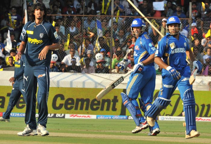 Rohit Sharma and Andrew Symonds run between the wickets as Ishant Sharma looks on during the IPL Twenty20 match between Deccan Chargers and Mumbai Indians at the Rajiv Gandhi International Stadium in Hyderabad. (AFP Photo) IPL 4: Mumbai vs Deccan