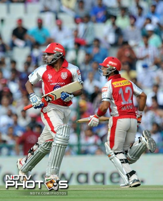 Nitin Saini and Mandeep Singh run between the wickets during the IPL Twenty20 match between Kings XI Punjab and Mumbai Indians at PCA Stadium in Mohali. (AFP Photo) IPL 5: Mumbai beat Punjab by 4 wickets