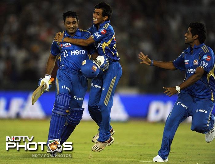Ambati Rayudu celebrates his team's victory with teammates after the IPL Twenty20 match between Kings XI Punjab and Mumbai Indians at PCA Stadium in Mohali. (AFP Photo) IPL 5: Mumbai beat Punjab by 4 wickets