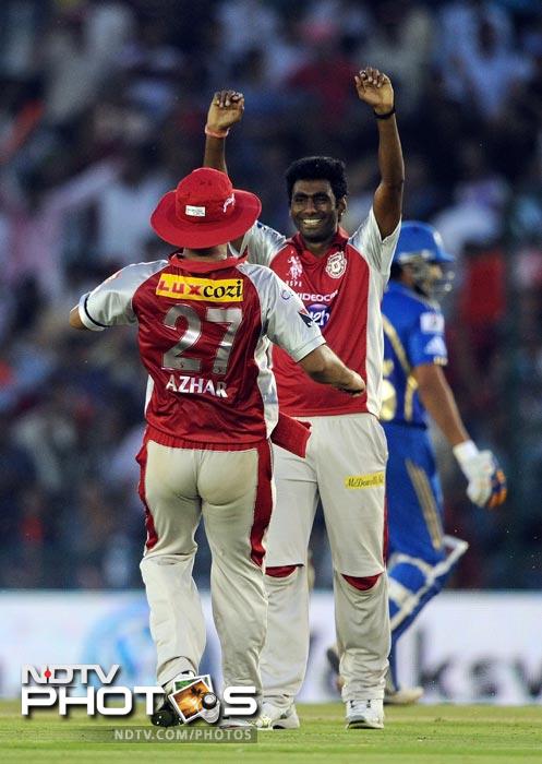 Parvinder Awana celebrates the wicket of Kieron Pollard during the IPL Twenty20 match between Kings XI Punjab and Mumbai Indians at PCA Stadium in Mohali. (AFP Photo) IPL 5: Mumbai beat Punjab by 4 wickets