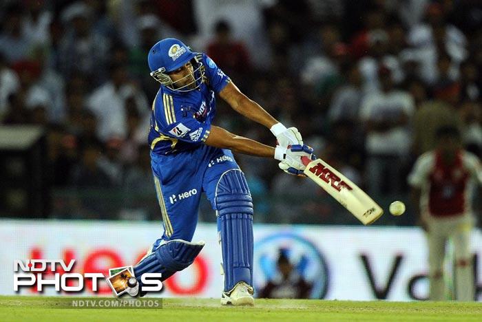 Rohit Sharma plays a shot during the IPL Twenty20 match between Kings XI Punjab and Mumbai Indians at PCA Stadium in Mohali. (AFP Photo) IPL 5: Mumbai beat Punjab by 4 wickets