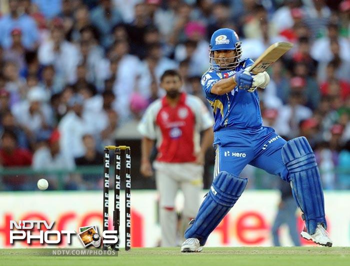 Sachin Tendulkar plays a shot during the IPL Twenty20 match between Kings XI Punjab and Mumbai Indians at PCA Stadium in Mohali. (AFP Photo) IPL 5: Mumbai beat Punjab by 4 wickets