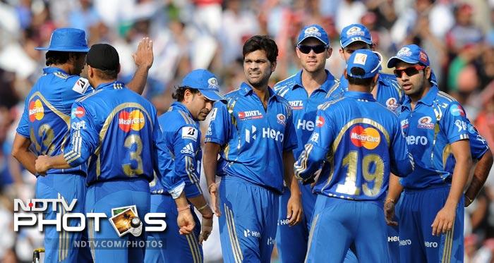RP Singh celebrates the wicket of Mandeep Singh with teammates during the IPL Twenty20 match between Kings XI Punjab and Mumbai Indians at PCA Stadium in Mohali. (AFP Photo) IPL 5: Mumbai beat Punjab by 4 wickets