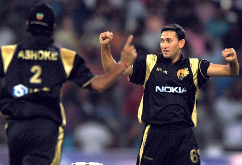 Kolkata Knight Riders' cricketer Ajit Agarkar celebrates the wicket of Jaques Kalies during the inaugural IPL T20 Championship match at Chinnaswamy stadium in Bangalore on Friday (PTI Photo) 1st Match: Knight Riders vs Royal Challengers