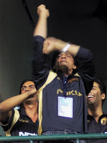 Kolkata Knight Riders' owner Shah Rukh Khan cheers his team during the inaugural IPL T20 Championship match at Chinnaswamy stadium in Bangalore on Friday. (PTI Photo) 1st Match: Knight Riders vs Royal Challengers