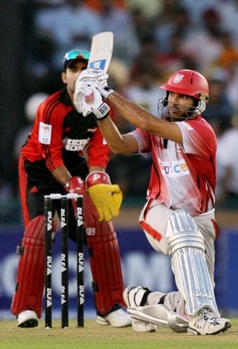 Kings XI Punjab skipper Yuvraj Singh plays a shot in the match against Delhi Daredevils during the IPL championship at Mohali on Sunday. Kings XI won the match by four wickets. (PTI Photo) 13th Match: Kings XI Punjab vs Delhi Daredevils