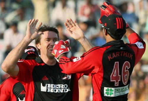 Kings XI Punjab player McGrath celebrates Delhi Daredevils player Virendra Sehwag's wicket during the IPL Championship at Mohali on Sunday. (PTI Photo) 13th Match: Kings XI Punjab vs Delhi Daredevils