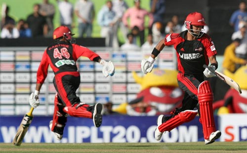 Delhi Daredevils' players Dinesh Karthik and Manoj Tiwary run between the wickets during their match against Kings XI Punjab in IPL Championship at Mohali on Sunday. (PTI Photo) 13th Match: Kings XI Punjab vs Delhi Daredevils