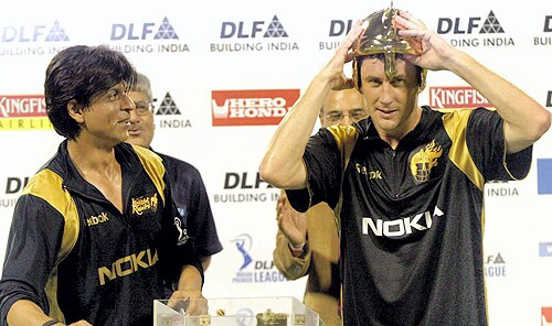 Kolkata Knight Riders' owner Shah Rukh Khan looks on as the Man of the Match David Hussey puts on the helmet presented to him after the IPL T20 match at Eden Gardens in Kolkata on Sunday. (PTI Photo) 4th Match: Kolkata Knight Riders vs Deccan Chargers