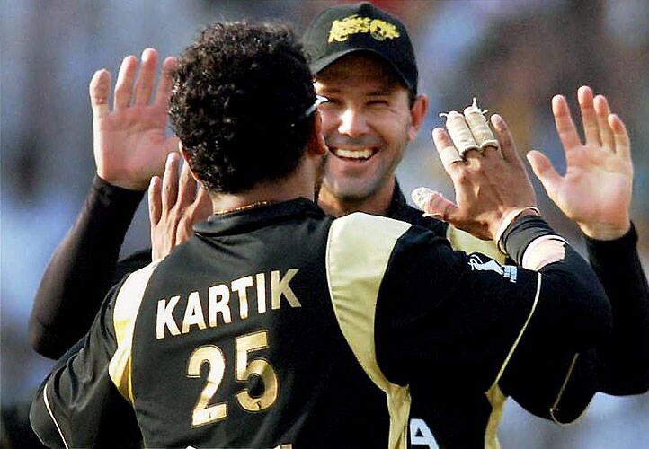 Kolkata Knight Riders Murali Kartik celebrates with teammate Ricky Ponting after taking the wicket of Deccan Chargers' Adam Gilchrist during the IPL match at Eden Gardens in Kolkata on Sunday. (PTI Photo) 4th Match: Kolkata Knight Riders vs Deccan Chargers