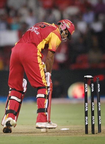 Bangalore lost their way towards the end, losing cheap wickets. Here, Praveen Kumar is bowled by Glenn McGrath. — <i>PTI Photo</i> 43rd Match: Bangalore Royal Challengers vs Delhi Daredevils