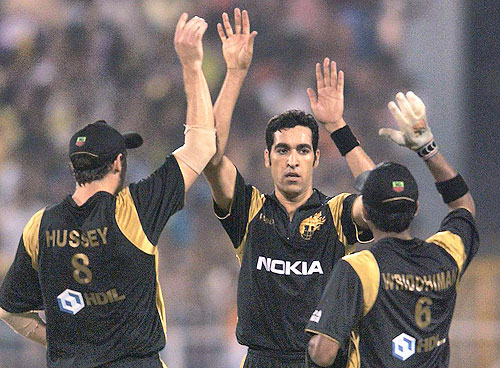 Umar Gul along with his team mates celebrate the wicket of Kumar Sangakkara of the Kings XI Punjab during the IPL match at Eden Gardens in Kolkata. (PTI Photo) 52nd Match: Kolkata Knight Riders vs Kings XI Punjab