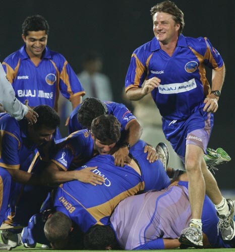 Rajasthan's players rushed on the field to celebrate the win with Neeraj Patel and Ravindra Jadeja. —<i>PTI Photo</i> 53rd Match: Rajasthan Royals vs Mumbai Indians