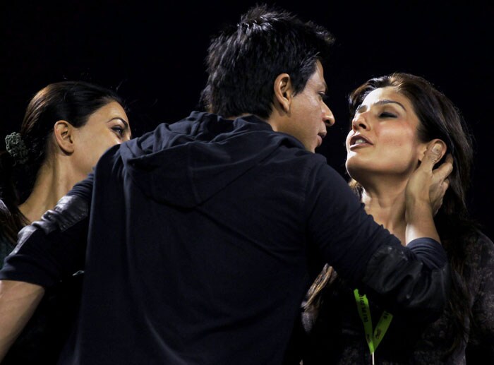 Actors Shah Rukh Khan greets Raveena Tandon (R) as Sushmita Sen looks on before the start of the IPL T20 match between Kolkata Knight Riders and Deccan Chargers at Eden Gardens. (PTI Photo) IPL 3: Kolkata vs Chargers
