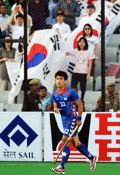 South Korean hockey player Jang Jong Hyun celebrates scoring a goal against Canada during their World Cup 2010 match at the Major Dhyan Chand Stadium in New Delhi. (AFP Photo) South Korea beat Canada