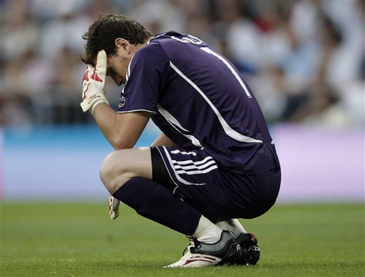 Real Madrid goal keeper Iker Casillas reacts after Mallorca opened the scoring during the Spanish League soccer match against Mallorca in Madrid. Real Madrid win La Liga