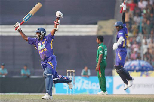 Muttiah Muralitharan and Farveez Maharoof celebrate their victory over Bangladesh at the end of the final match of the triangular one-day series in Dhaka. Sri Lanka win tri-series final