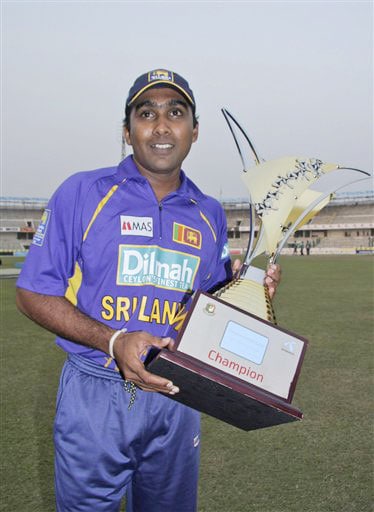 Sri Lankan captain Mahela Jayawardene poses with the trophy after his team's victory over Bangladesh at the end of the final match of the triangular one-day series in Dhaka. Sri Lanka win tri-series final