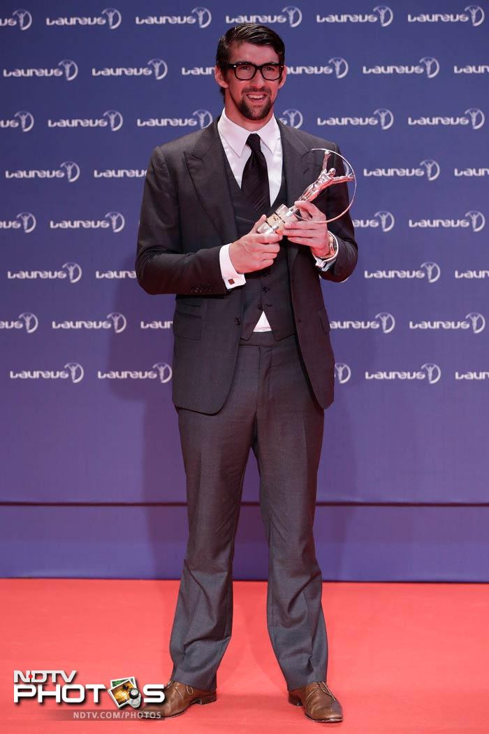 A 'different' looking Michael Phelps won the special Laureus Academy award as the most decorated Olympian of all time with 18 gold, two silver and two bronze medals.