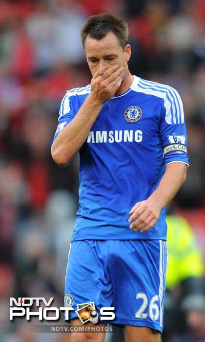 John Terry reacts at the final whistle after his team were beaten 3-1 in the English Premier League football match between Manchester United and Chelsea at Old Trafford. (AFP Photo) Manchester United thrash Chelsea 3-1
