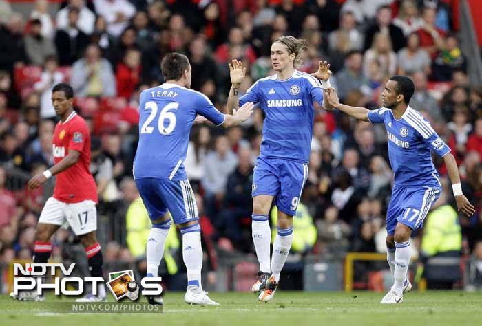 Fernando Torres, second right, celebrates with teammates John Terry, second left, and Jose Bosingwa after he scored a goal against Manchester United during their English Premier League soccer match at Old Trafford. (AP Photo) Manchester United thrash Chelsea 3-1