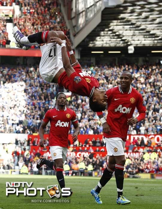 Nani, center, celebrates with teammates Ashley Young, right, and Patrice Evra after scoring a goal against Chelsea during their English Premier League soccer match at Old Trafford,. (AP Photo) Manchester United thrash Chelsea 3-1