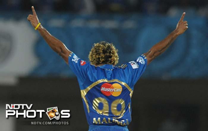 It was Lasith Malinga who gave Mumbai the prized wicket as he dismissed Dhawan after the batsman had struck as many as four sixes and two boundaries. (AFP PHOTO / Noah SEELAM) IPL 5: Mumbai defeat Deccan in a thriller