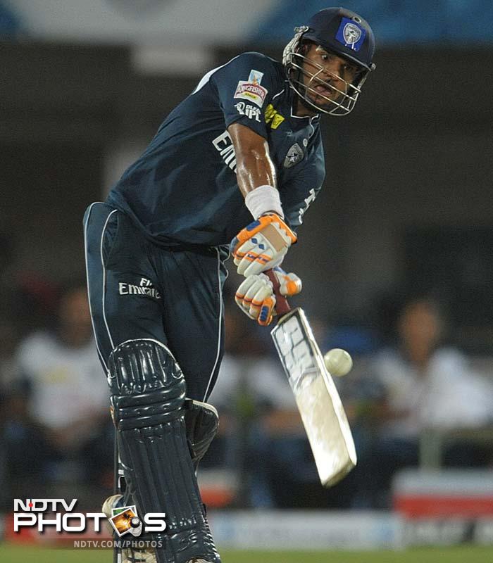 It could have been a disaster for Deccan but Shikhar Dhawan managed to fight and help himself to 41 off 24 balls. (AFP PHOTO / Noah SEELAM) IPL 5: Mumbai defeat Deccan in a thriller