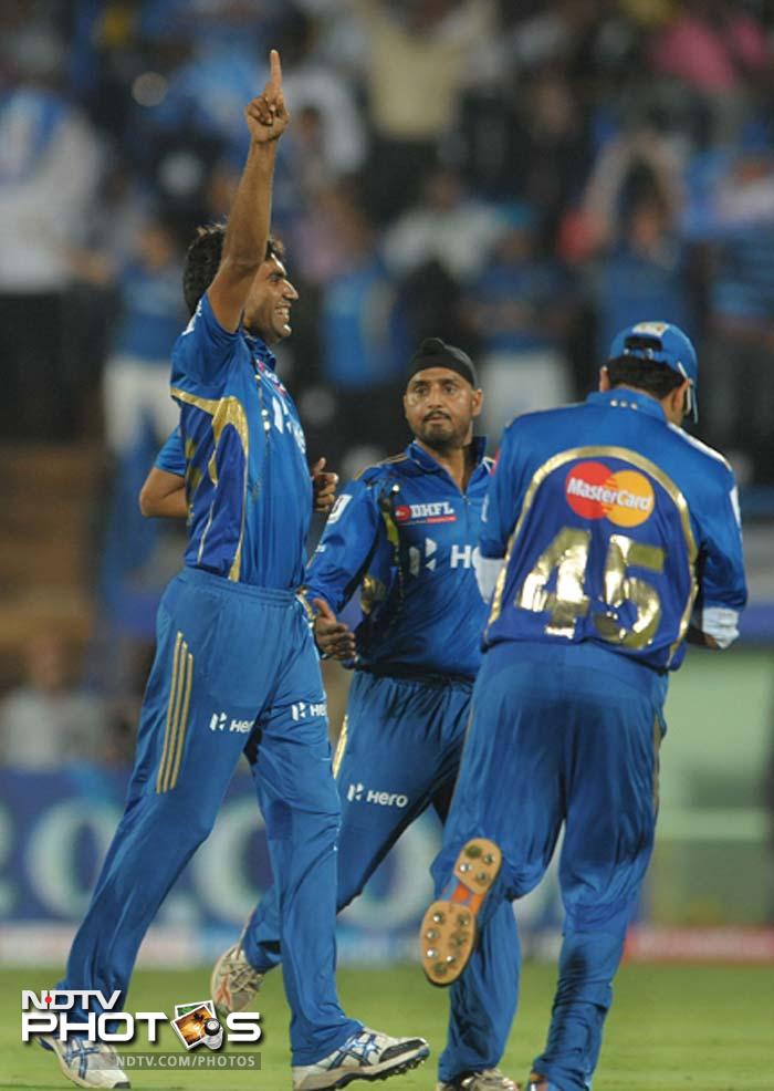 The day began with Munaf ripping the Deccan batting with his torrid bowling. His team had been asked to bowl but he ensured that most of the batsmen had trouble against him. (AFP PHOTO / Noah SEELAM) IPL 5: Mumbai defeat Deccan in a thriller