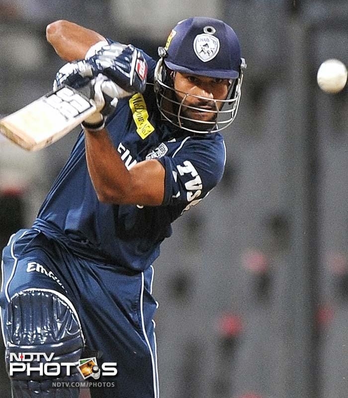Opener Shikhar Dhawan was again Deccan's best batsman making 29 runs. (AFP PHOTO/Punit PARANJPE) IPL 5: Mumbai edge past Deccan in low-scorer