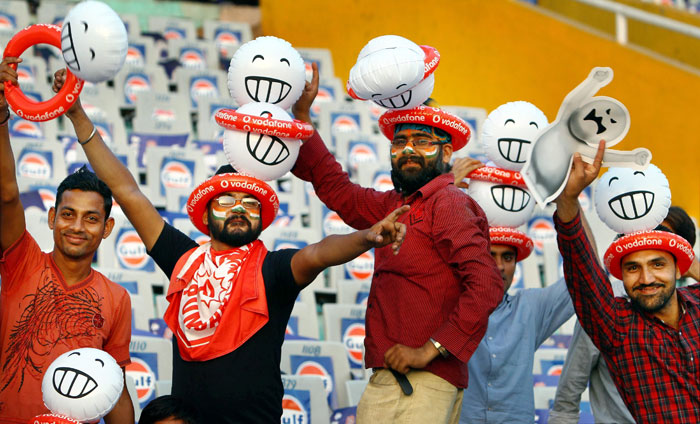 Cricket fans dance before the start of IPL T20 match between Kings XI Punjab and Rajasthan Royals in Mohali. (PTI Photo) IPL 3: Mohali vs Rajasthan
