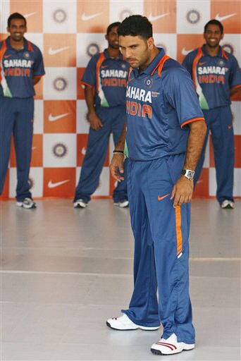 Yuvraj Singh displays the new apparel for the Indian one-day international team in Mumbai on Wednesday. (AP Photo) New jersey for Team India