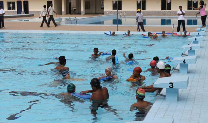Warm up at the Fittest City Contest, Swimming Camp with Nisha Millet begins.