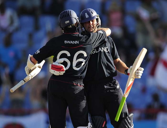 Tim Bresnan is congratulated by teammate Graeme Swann after hitting England's winning run during the ICC World Twenty20 Super Eight match between New Zealand and England at the Beausejour Cricket Ground on May 10, 2010 in Gros Islet, St Lucia. England won by 3 wickets to qualify for the semifinals.(AFP PHOTO) WT20: NZ vs Eng