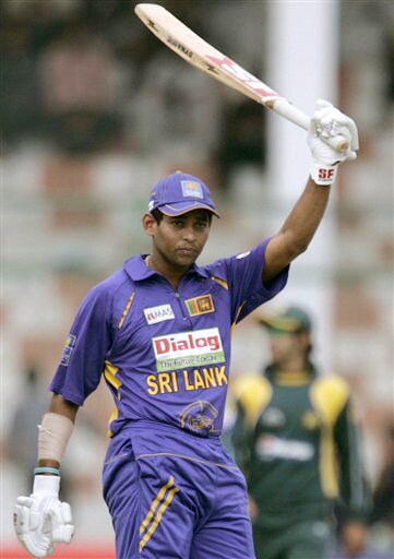 Tillakaratne Dilshan raises his bat to celebrate fifty against Pakistan during their second ODI match at National Stadium in Karachi on Wednesday. (AP Photo) 2nd ODI: Pakistan vs Sri Lanka
