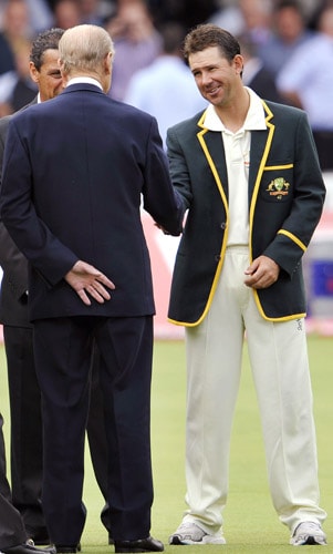 Britain's Prince Phillip speaks with Australian captain Ricky Ponting as he and Queen Elizabeth II meet the England and Australian teams during the lunch break on the second day of the second Test match at Lords in London. (AFP Photo) Queen's date with cricket