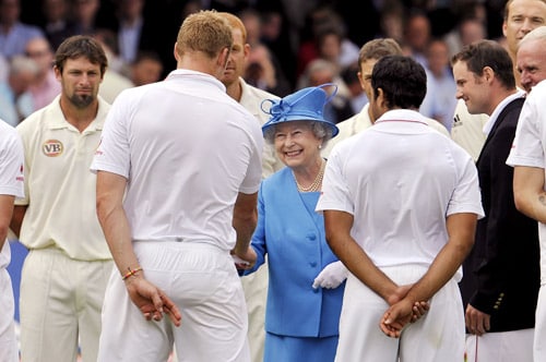 Britain's Queen Elizabeth II shakes hands with England's Andrew Flintoff as she meets the England and Australian teams during the lunch break on the second day of the second Test match at Lords in London. (AFP Photo) Queen's date with cricket