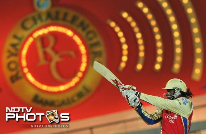 It was Chris Gayle who unleashed batting fury and slapped sixes galore to put his team on track and set the base for the chase. (AFP PHOTO/Manjunath KIRAN) IPL 5: Bangalore down Pune in a thriller